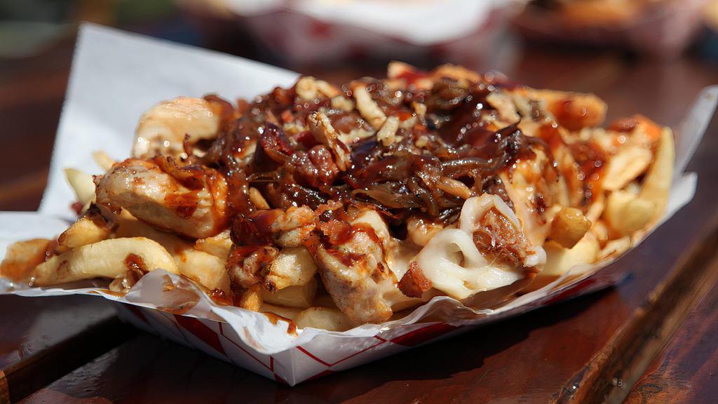 Hei Hei Chicken Fries · Bed of Fries smothered in Chopped Blackened Grilled Chicken, Shredded Cheese, Grilled Onions, Bacon Bits, Buttermilk Ranch and Onion Crisps.
