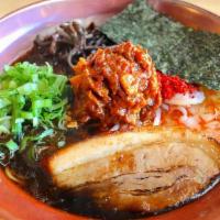 Spicy Ramen · Our new spicy ramen, topped with roast pork chashu. Also topped with  green onion, spicy por...