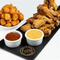 Combo Wings (18) · Traditiona Bone-In or Boneless Wings tossed in sauce, with your choice of Fries or Tots, and...
