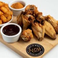 Combo Wings (12) · Traditiona Bone-In or Boneless Wings tossed in sauce, with your choice of Fries or Tots, and...