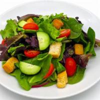 Garden Salad · Mixed greens, tomatoes, cucumbers, and croutons served with your dressing choice.