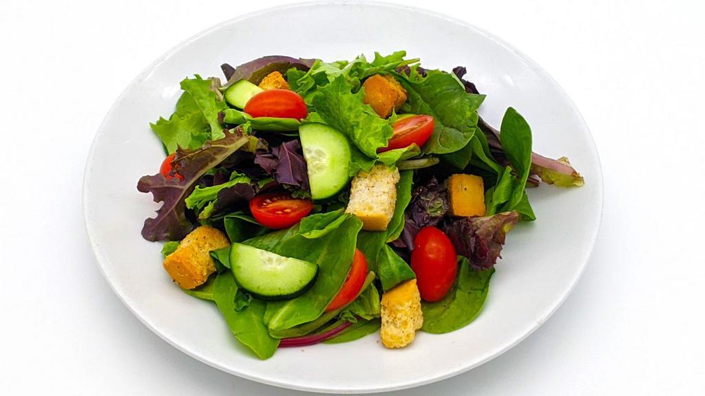 Garden Salad · Mixed greens, tomatoes, cucumbers, and croutons served with your dressing choice.
