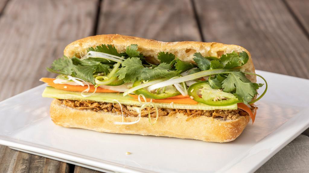 Z7M. Chicken Bánh Mì · Shredded roasted chicken, demi baguette, pickled carrots & daikon, cilantro, scallions, cucumbers, jalapeno, garlic aioli.