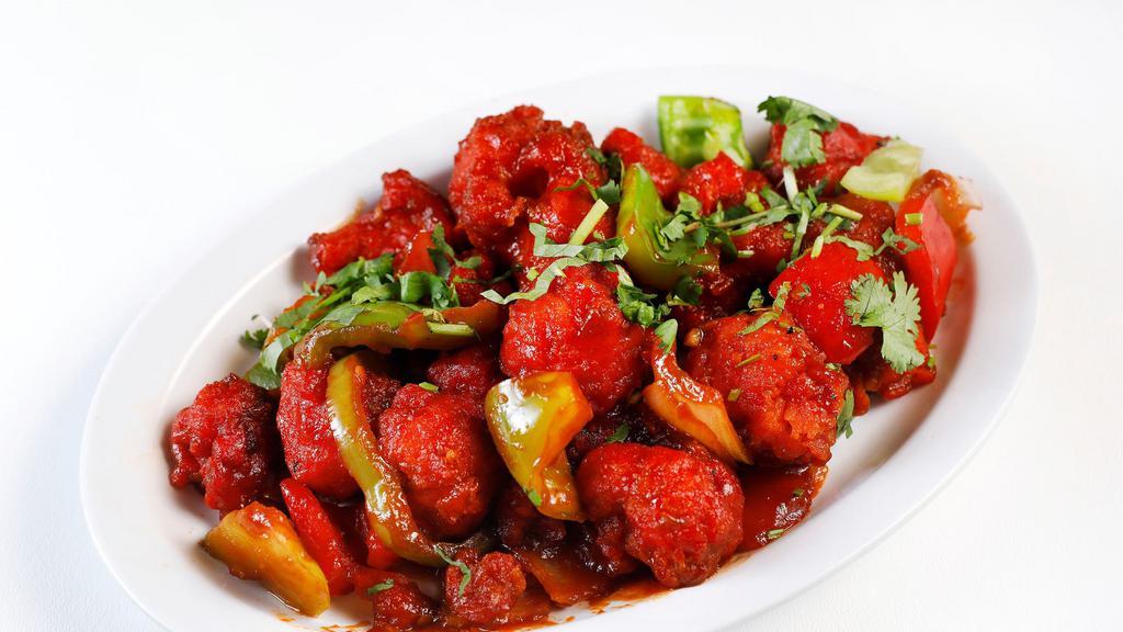 Gobi Manchurian · Batter fried cauliflower topped with soy sauce.