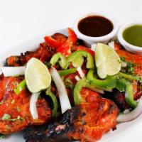 Tandoori Chicken · Chicken delicately marinated in fresh aromatic spices and herds and tenderly cooked in tradi...