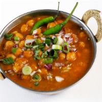 Chana Masala · Traditional North Indian dish comprised of chick peas in a flavorful curry.