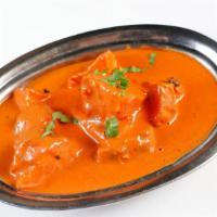 Chicken Tikka Masala · Tender boneless pieces of chicken cooked with tomatoes, bell peppers, onions and tomatoes, f...