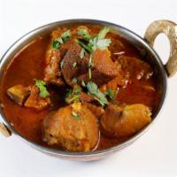 Goat Curry · Goat with rich Indian spices and onion tomato gravy.