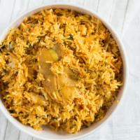Chicken Biryani · Basmati rice cooked with chicken, onions, tomatoes and rose water.