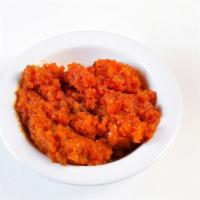 Gajar Halwa · Cooked shredded carrots with nuts.