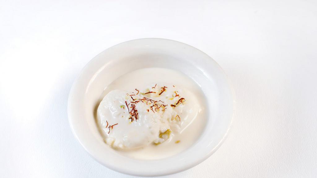 Ras Malai ( 2 pcs) · Rounded patties of curded milk submerged in a light and creamy sauce.