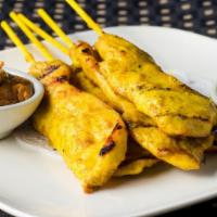 Satay · 5 Grilled skewered strips of marinated chicken breast served with peanut curry sauce and cuc...