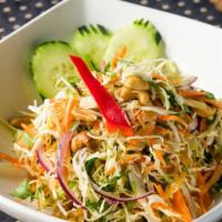 Ginger Salad · Sliced ginger, cashew nuts, peanuts, cabbage, carrots, red onions, cilantro, and scallions t...