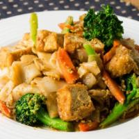 Pad See Eew · Stir fry thick rice noodles with brown bean soy sauce, broccoli, egg, carrots, and your choi...