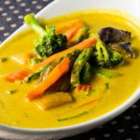 Pumpkin Veggie Curry · Pumpkin, eggplant, broccoli, string beans, and carrots stir-fried in yellow curry garlic sau...