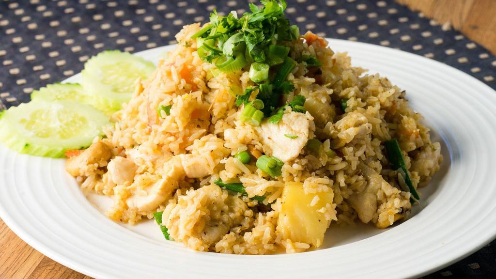 Fried Rice · Stir-fried jasmine rice with eggs, garlic, tomatoes, carrots, pineapple, green peas, cashew nut, onions, scallions, cilantro, and your choice of chicken, beef, pork, or tofu.