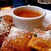 Toasted Raviolis · Fresh baked ravioli twisted and cooked to perfection