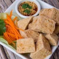 Crispy Fried Tofu · Crispy fried tofu, served with homemade spicy chili sauce and crush peanut.