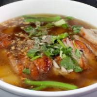 Roast Duck Noodle Soup · Noodle with boneless roasted duck and Yao Choy in Chinese herb duck broth.