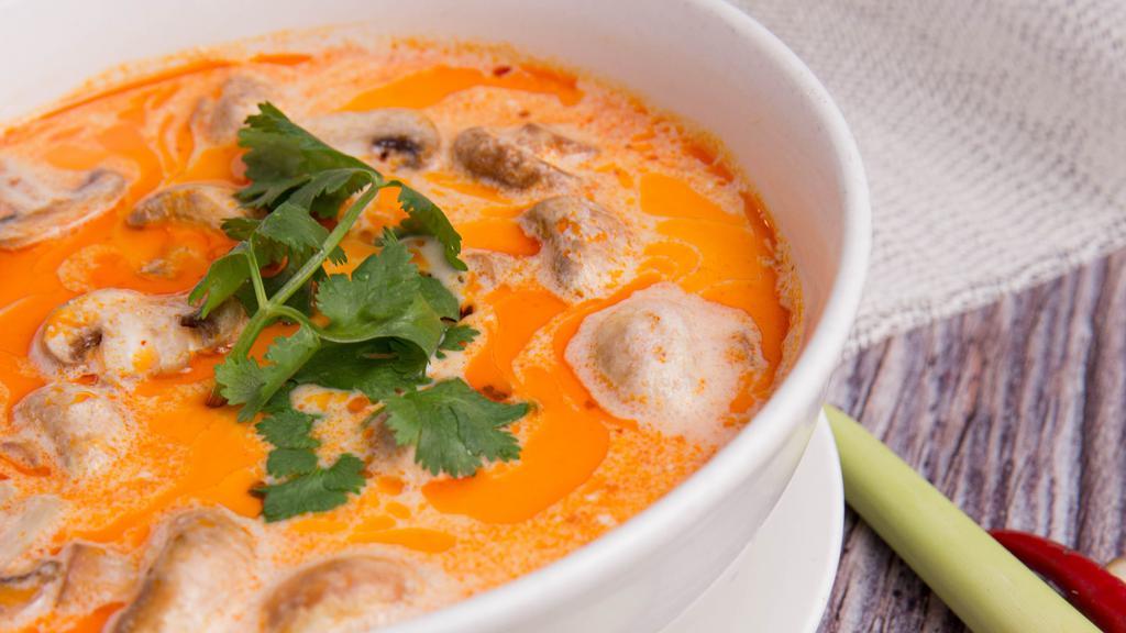 Tom Kha Soup · Thai style hot and sour soup with chicken, coconut milk, mushroom, galanga and lemongrass.