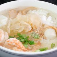 Seafood Noodle Soup · Noodles with shrimp, calamari, fish ball, and bean sprout in clear broth.