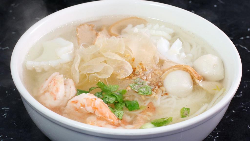 Seafood Noodle Soup · Noodle with shrimps, calamari, imitation crab meats, fish balls, sliced fish cakes, white mushroom, and bean sprout in chicken broth with lime, chili, and ground peanut.