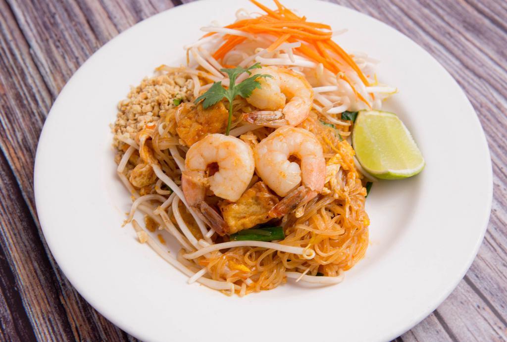Pad Thai · Stir fried small rice noodle, shrimp, dry shrimp, egg, ground peanut, tofu, and bean sprouts with red paprika powder and lime juice. Vegetarian option available.
