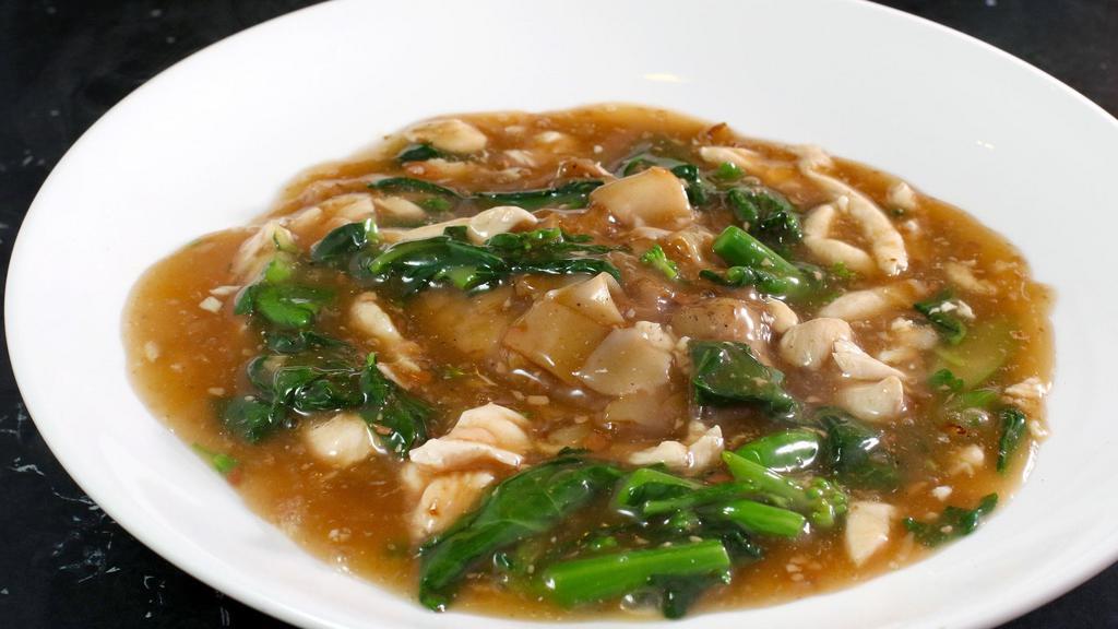 Rad Nar · Thai style gravy sauce with Chinese broccoli and your choice of meat served over stir fried flat rice noodle. Vegetarian option available.