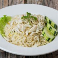 Crab Meat Fries Rice · Fried rice with white crabmeat, egg, white onions, green onions and topped with cucumber.