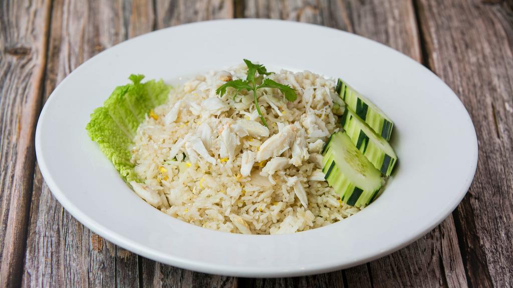 Crab Meat Fried Rice · Thai style fried rice with white crab meat, egg, white onions, green onions, topped with cilantro and cucumber.