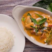 Panang Curry · Thai red curry with bell pepper and Thai basil and mixed with peanut sauce served with steam...