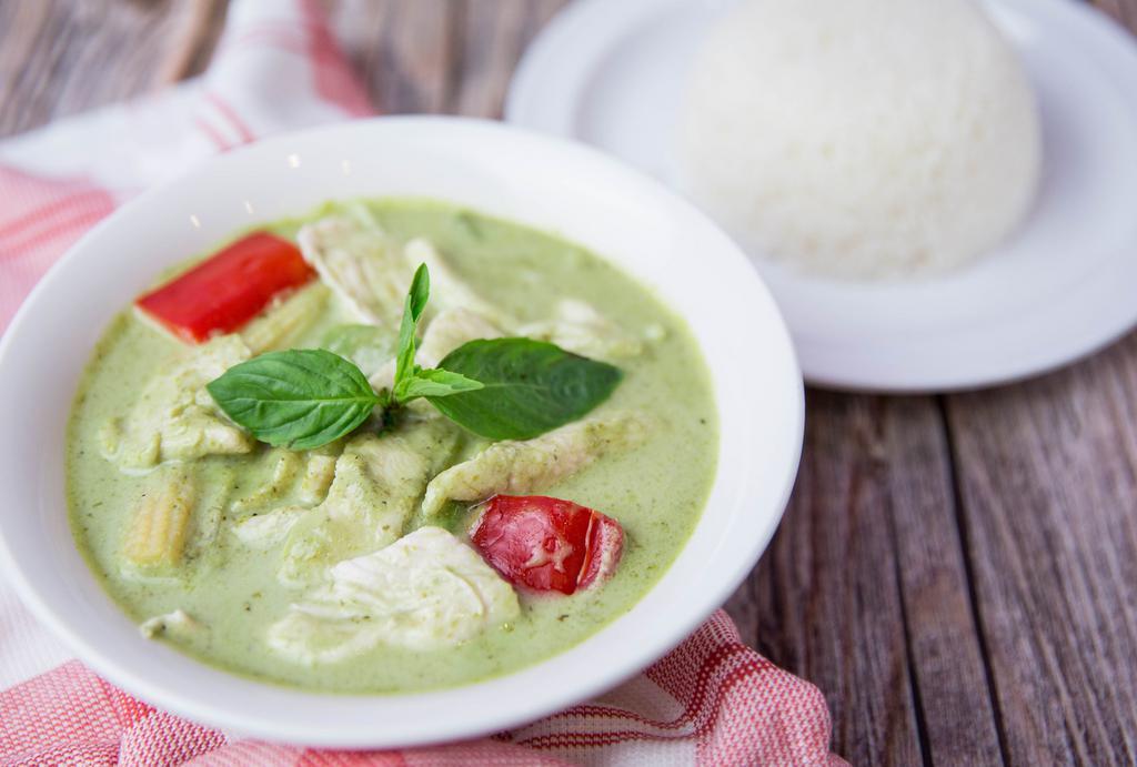 Green Curry · Thai green curry with bell pepper, bamboo shoot, green bean, and basil served with steamed rice.