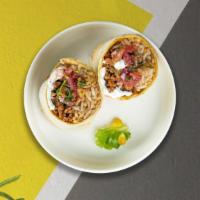 Super Duper Burrito · Choice of meat, rice, beans, Mexican salsa, cilantro, and onion.