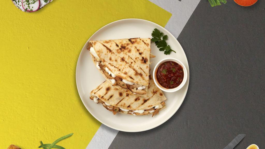 Swiss Quesadilla · A big flour tortilla with melted cheese and choice of meat.