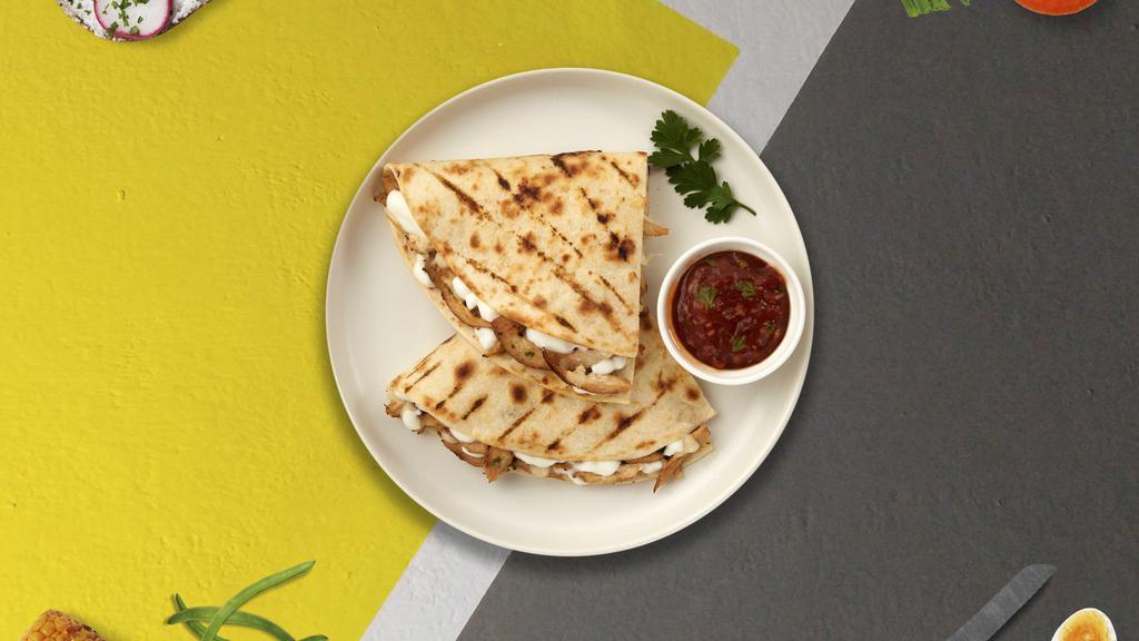 Flour Power Quesadilla · A big flour tortilla with melted cheese.