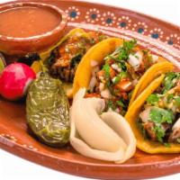 3 Tacos Chicos · 3 delicious tacos, warm tortillas are topped with your choice of meat, onions, cilantro, and...