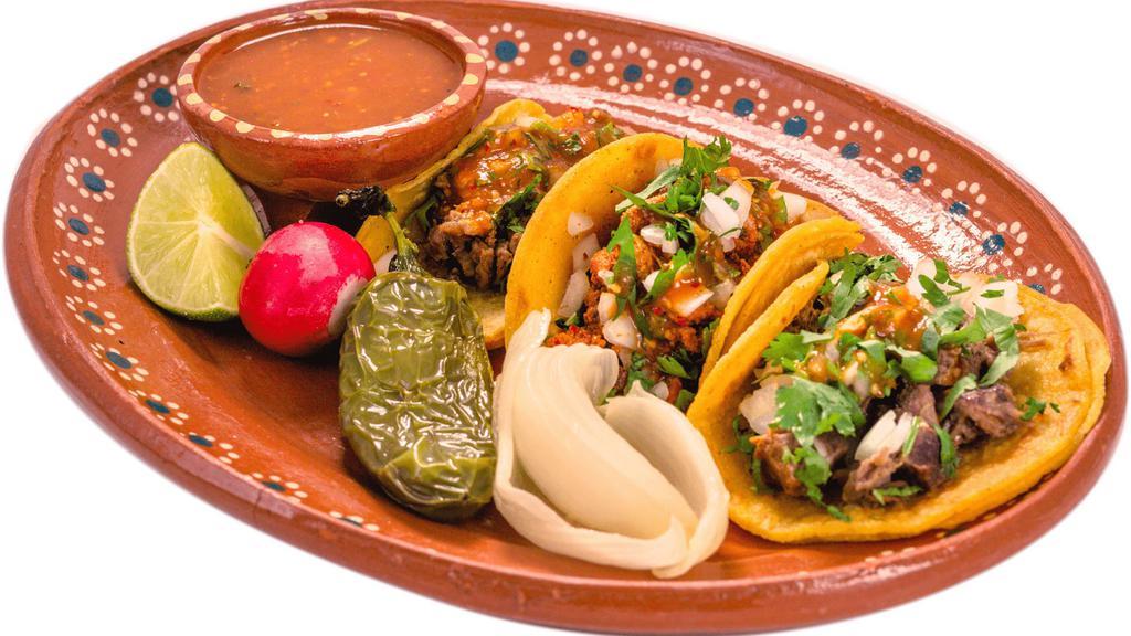 3 Tacos Chicos · 3 delicious tacos, warm tortillas are topped with your choice of meat, onions, cilantro, and salsa