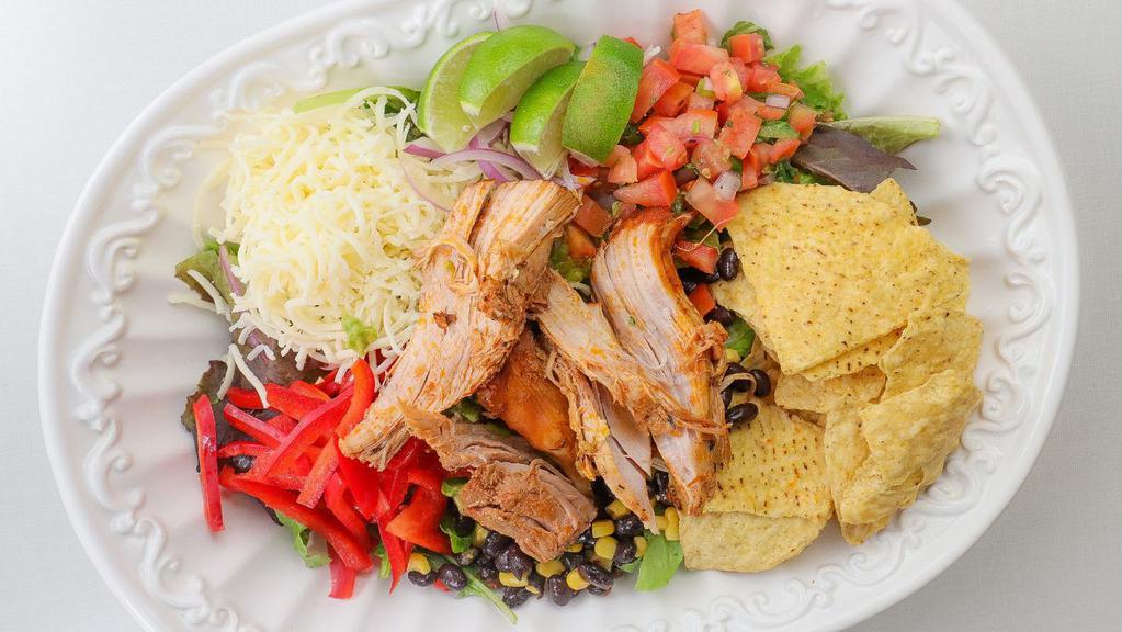 Slow Roasted Pork Salad · All salads come with organic mixed lettuce, bell pepper, black beans, corn, jicama, shredded Jack and Cheddar cheese, tomato, red onion, and tortilla chips.