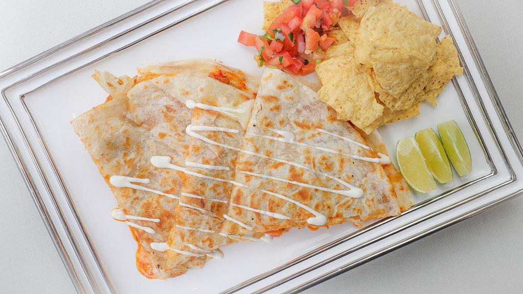 Pasilla's Spicy Chicken Quesadilla · Flour tortilla with melted cheese, fresh homemade salsa, choice of meat and sour cream.
