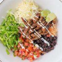 Grilled Marinated Steak Pasilla Bowl · Pinto or black beans, Spanish rice, fresh homemade salsa, cheese, sour cream, and lettuce.