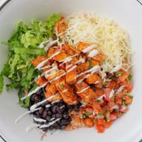Pasilla's Spicy Chicken Pasilla Bowl · Pinto or black beans, Spanish rice, fresh homemade salsa, cheese, sour cream, and lettuce.