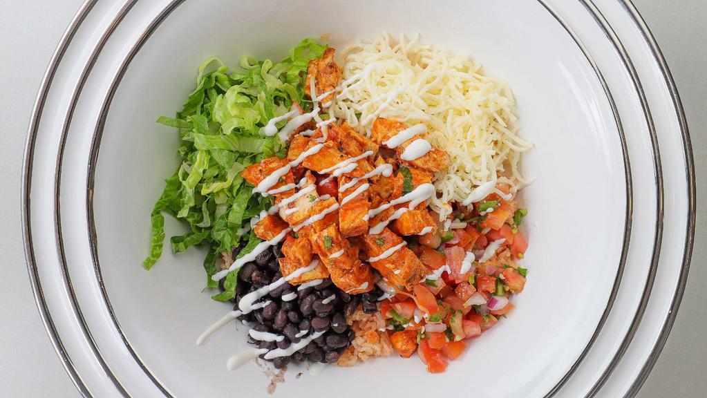 Pasilla's Spicy Chicken Pasilla Bowl · Pinto or black beans, Spanish rice, fresh homemade salsa, cheese, sour cream, and lettuce.