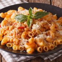 Macaroni with Tomato Sauce · Warm macaroni pasta topped with house made tomato sauce prepared with fresh herbs.