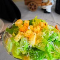 Insalata Cesare · Romaine lettuce, garlic croutons, anchovies dressing.