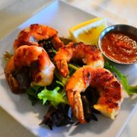 Scampi e Pancetta · Grilled prawns wrapped with Italian bacon.
