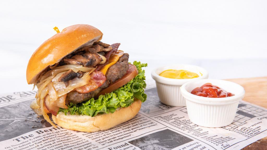 Tower Burger · Bacon, grilled onion, sautéed mushroom, cheddar cheese.