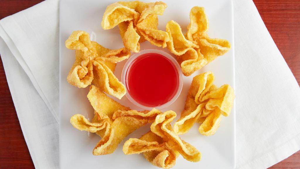 Crab Rangoon · 6 pieces of Crab rangoon deep fried with sweet and sour sauce on side.
contain cream cheese and imitation crab meat
