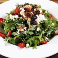 Kale Salad · Baby kale, spinach, crumbled goat cheese, dried cranberry, shaved almonds, strawberries toss...