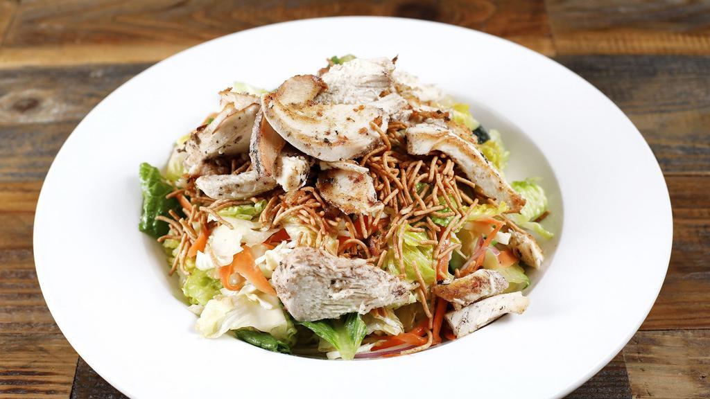 Chinese Chicken Salad · Romaine lettuce, carrots, onion, cucumber, cabbage, crispy noodles and chicken tossed with  sesame ginger dressing.