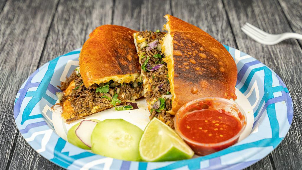 Birria Torta · Telera, cheese, beef Birria, cilantro, red onion. *our birria is made with beef, if you prefer chicken please write on the comments 